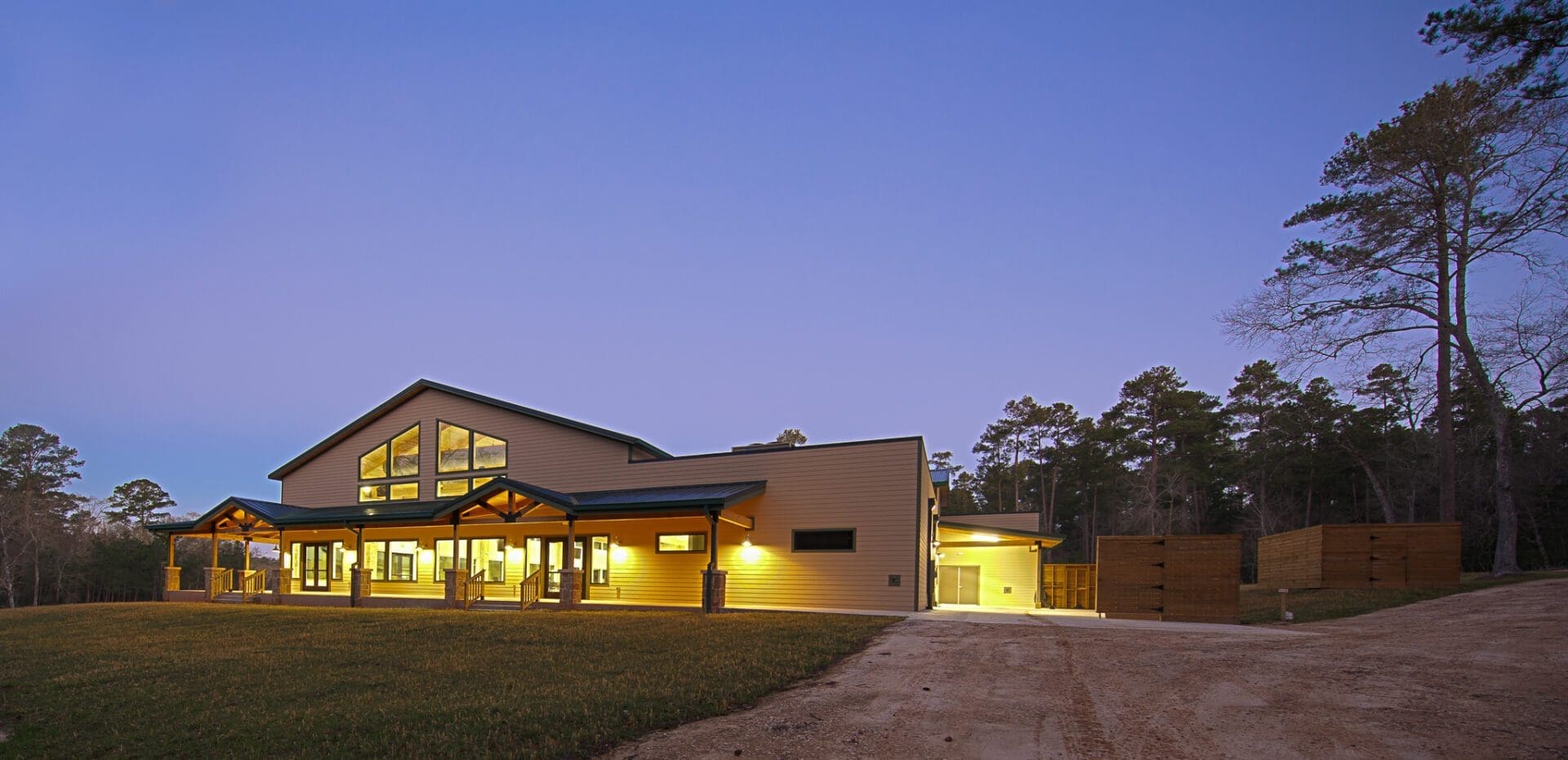 Modern building with lights at twilight.