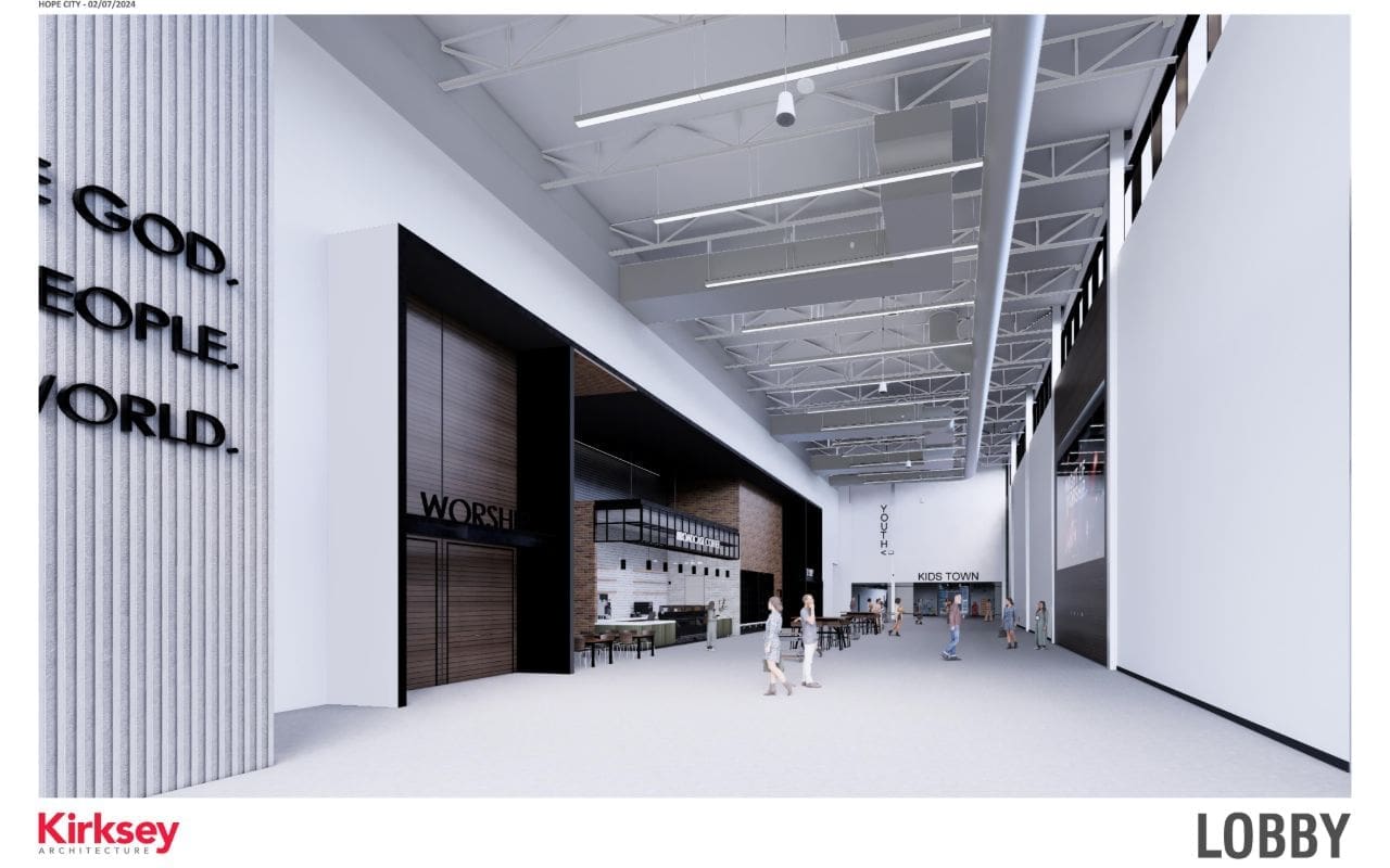 Modern lobby with high ceilings and signage.